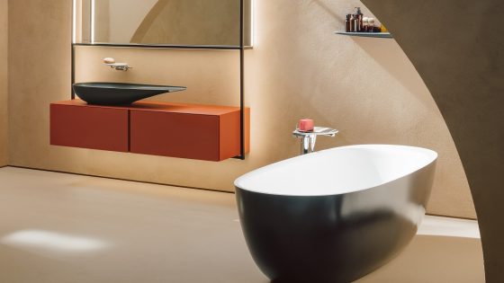 rendered image of Laufen_Ilbagnoalessi_collection with black bath and orange furniture