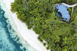 aerial view of coastline and Waldorf Astoria villa in Seychelles on Platte island