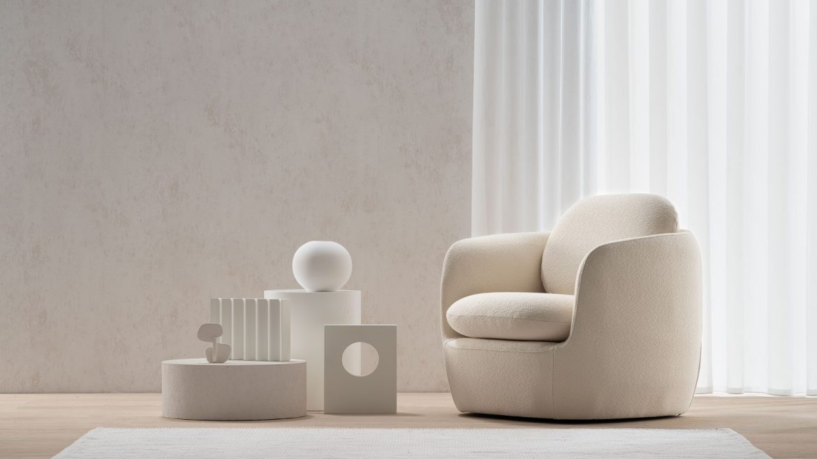 white rounded upholstered chair in a white room with white sculptural objets with Bilbao Chair from Morgan