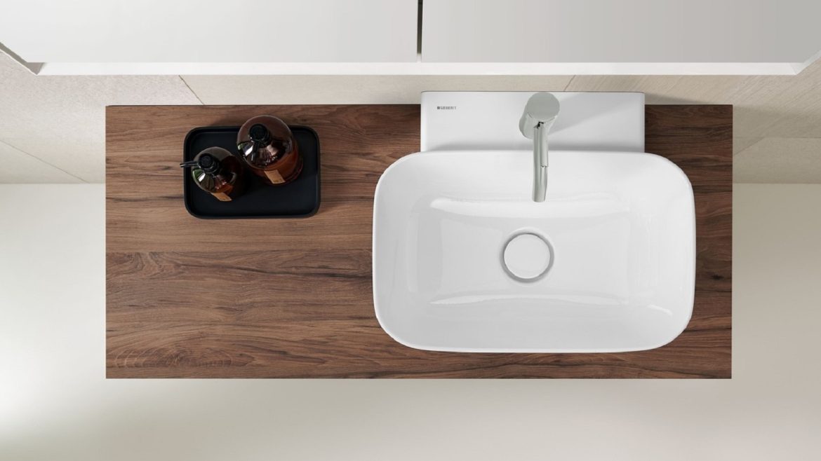 wooden vanity surface with white square Geberit handbasin on the surface
