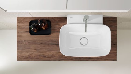 wooden vanity surface with white square Geberit handbasin on the surface