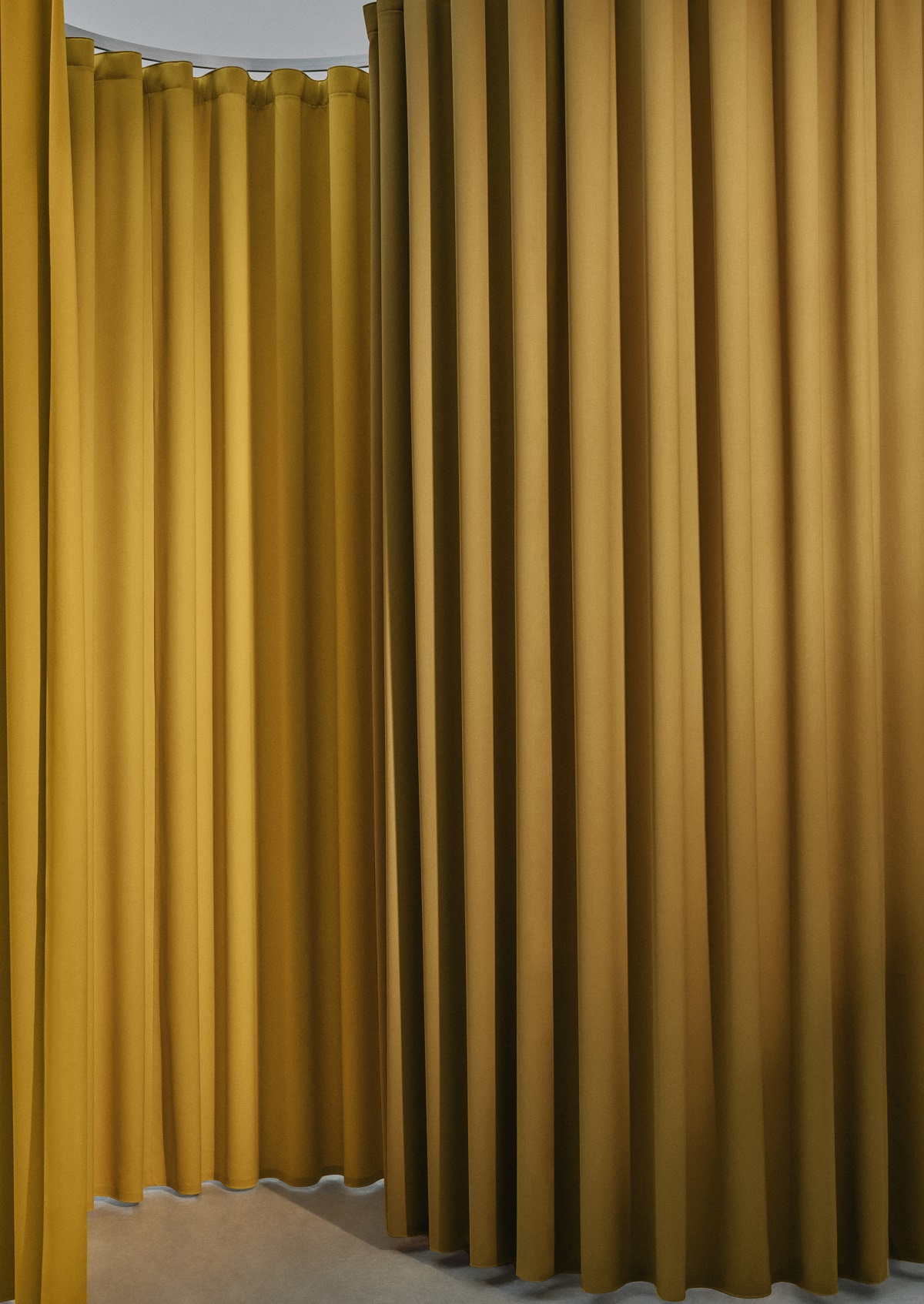 yellow Dedar pleated fabric as a divider