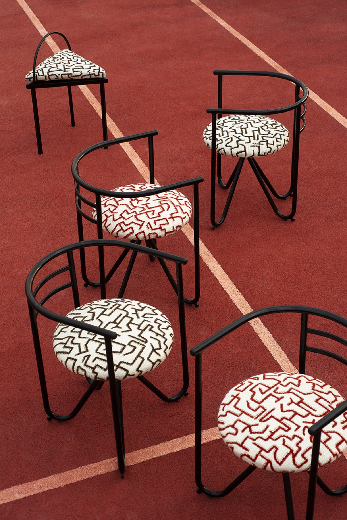 graphic chair design with Dedar fabric placed on tennis court