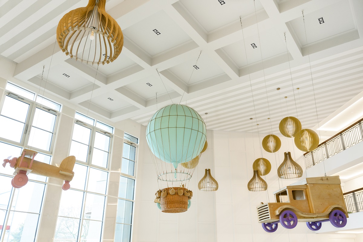 lamps and mobiles in the theme of Around the world in 80 days hang from the ceiling in Mövenpick BalaLand Resort Lake Balaton