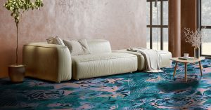 cream couch and small table on bright floral teal carpet in modieus Bello carpet range
