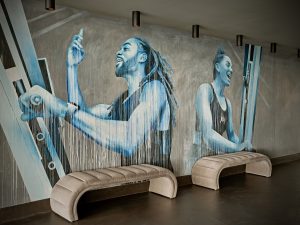 mural in industrial style contemporary gym design sweat by bxr by Bergman Interiors