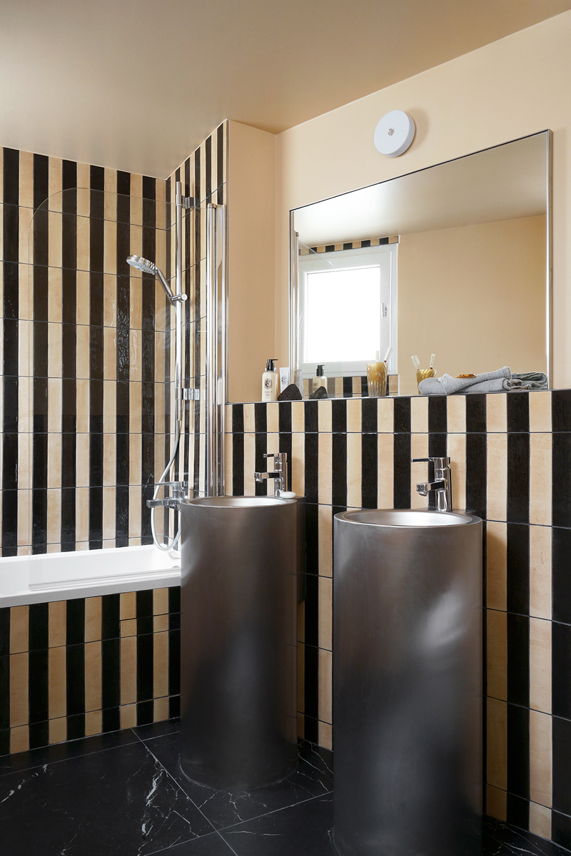 Black and white striped tiles in the bathroom