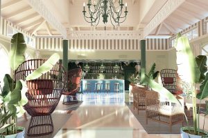 rattan chairs, palm trees and green accents in the entrance and lobby to Cayo Levantado Resort 