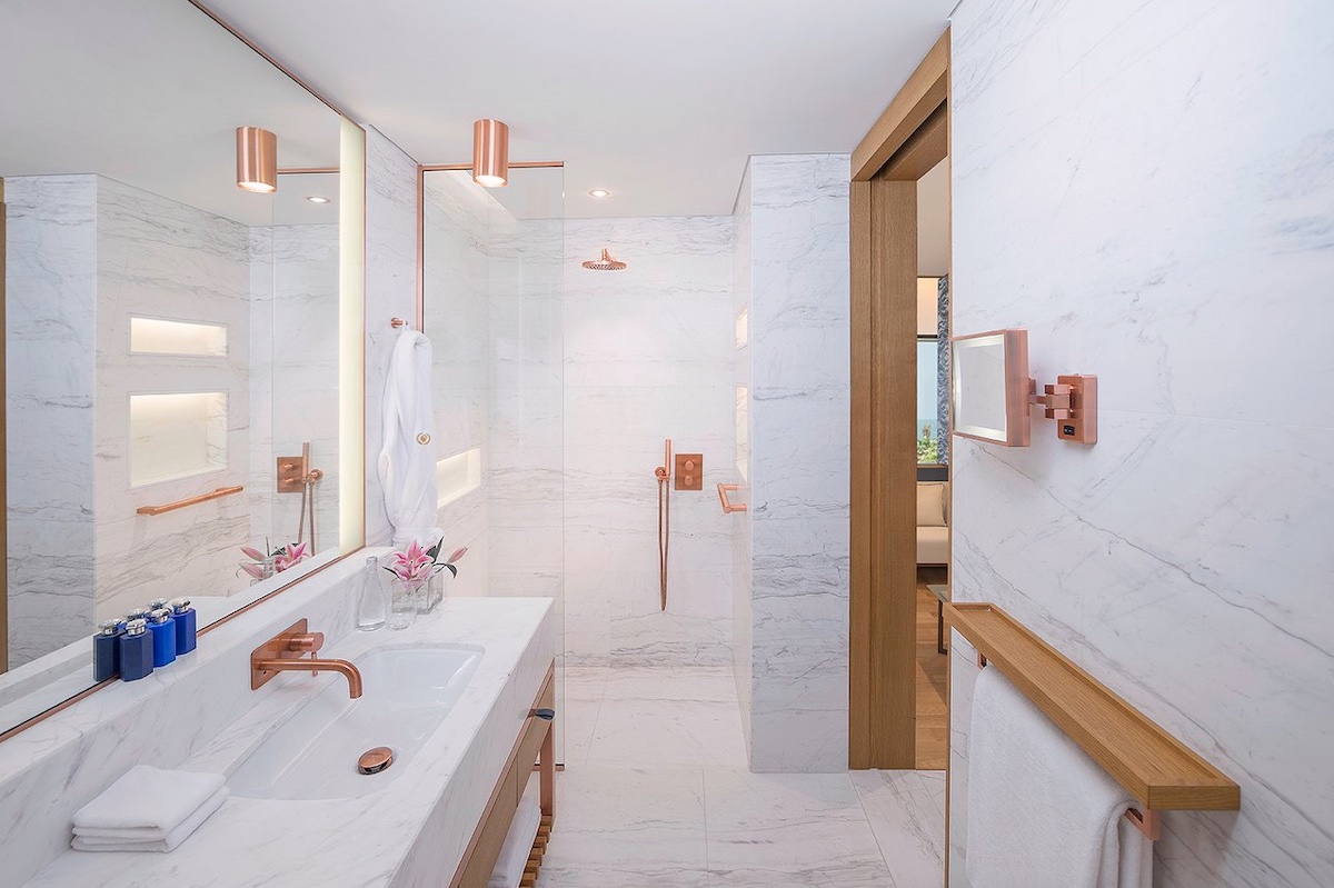 Caesars Resort bathroom in Dubai - white and rose gold design scheme