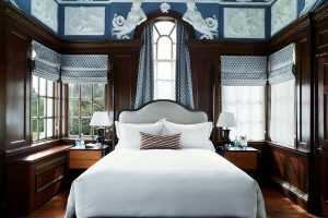 wedgewood blue bedroom with wood panelling in Monkey Island Estate