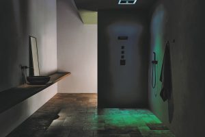 minimalist shower with green lighting integrated into the rainshower by Dornbracht