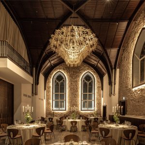 dramatic vaulted ceiling and chandelier in restaurant at Virgin Edinburgh by ICA Studio