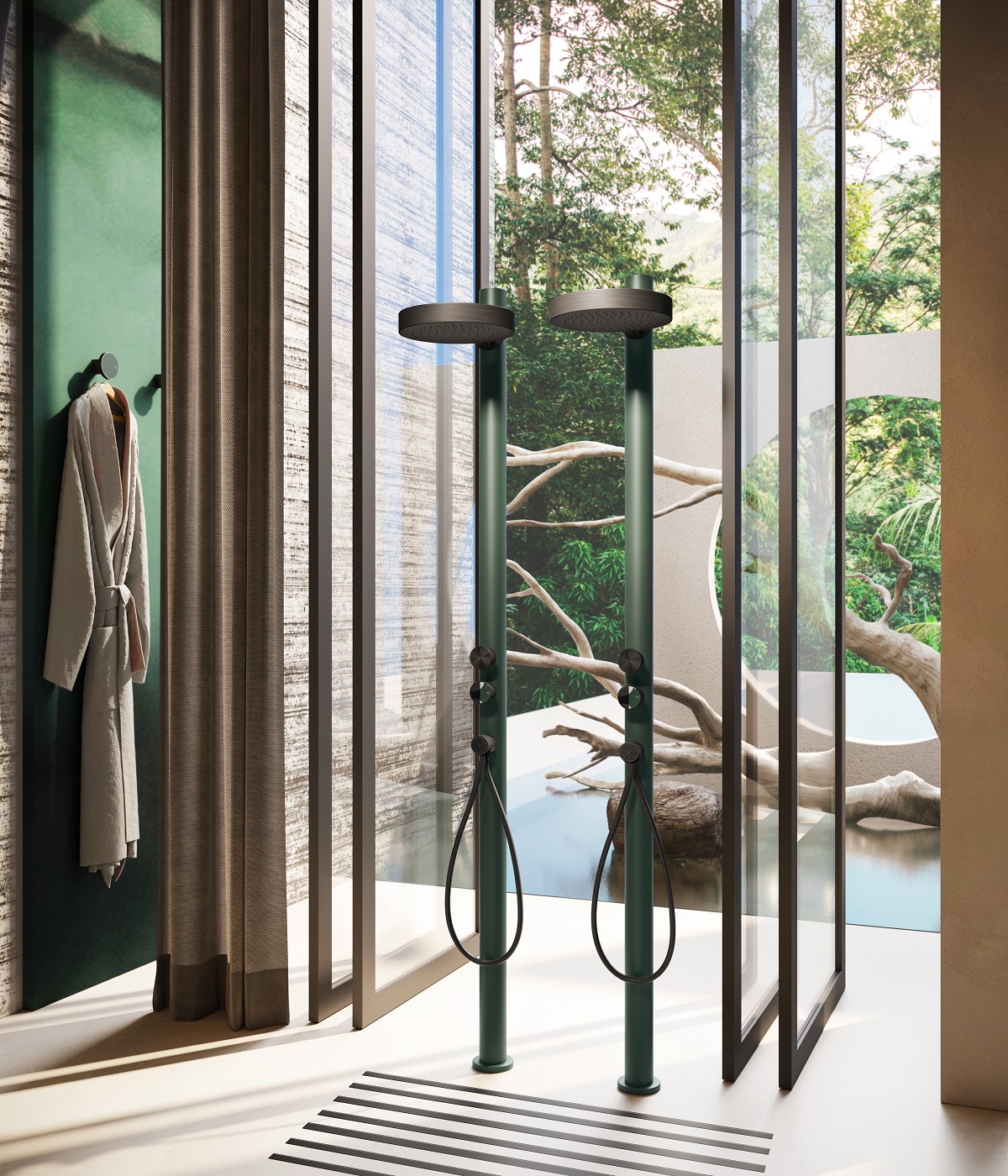 a green shower fitting against a glass wall looking into the garden from the GESSI Origini collection