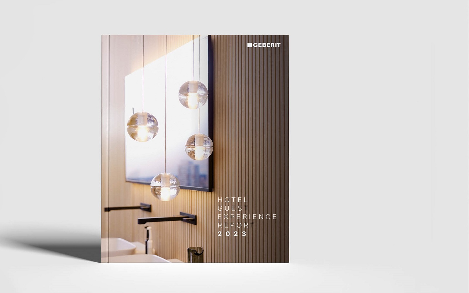 luxury bathroom detail on the front cover of the Geberit 2023 Hotel Guest Experience Report