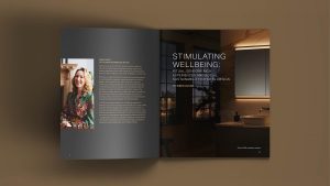 open page of Geberit Hotel Guest Report 2023 on a brown background with portrait of designer Wren Louks