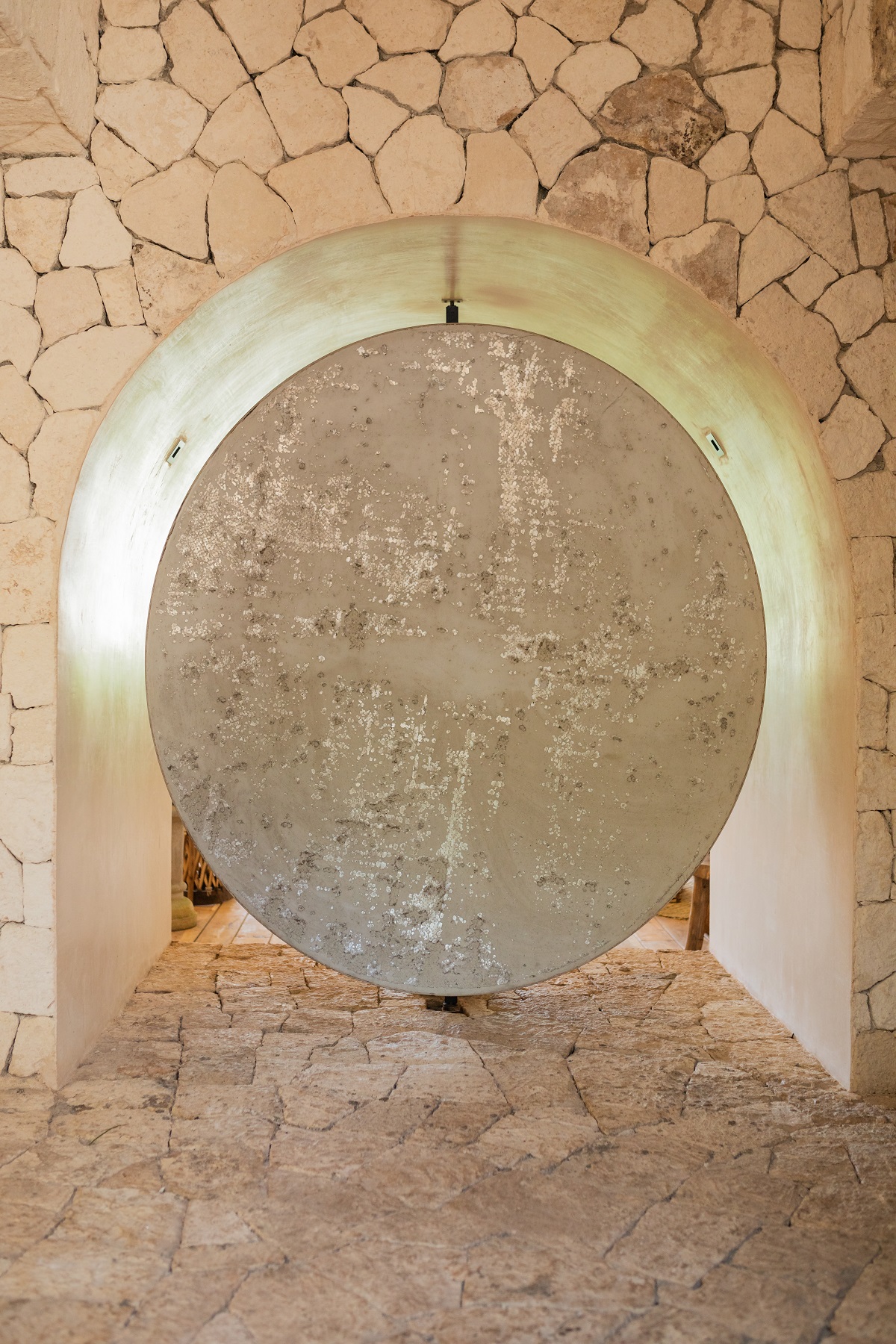 stonework detail with round disc at La Valise Tulum
