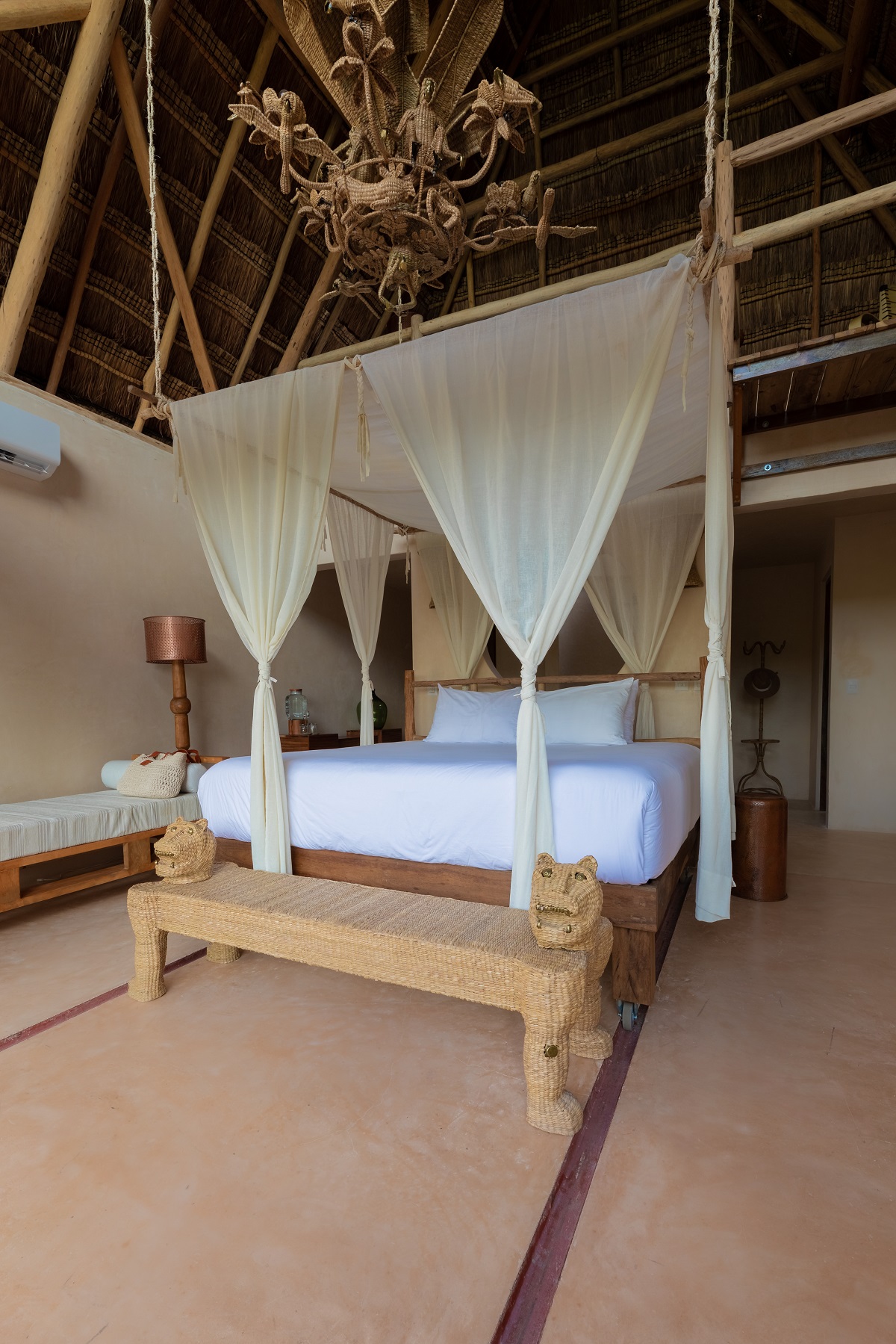 guestroom in La Valise Tulum with canopy and handcrafted furniture details