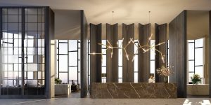 lobby and reception desk with statement chandelier and floor-to-ceiling windows 