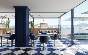 black and white checked floor, blue and gold art deco inspired furniture and floor to ceiling windows in the sky bar in Ocean Drive hotel Ibiza