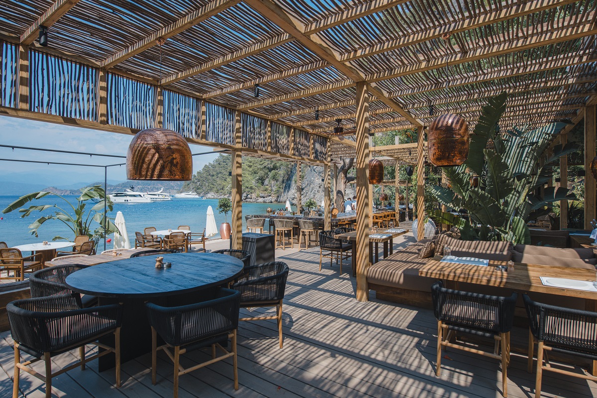 rustic wood and bamboo design of outdoor restaurant on the beach at Yazz Collectivein Turkey