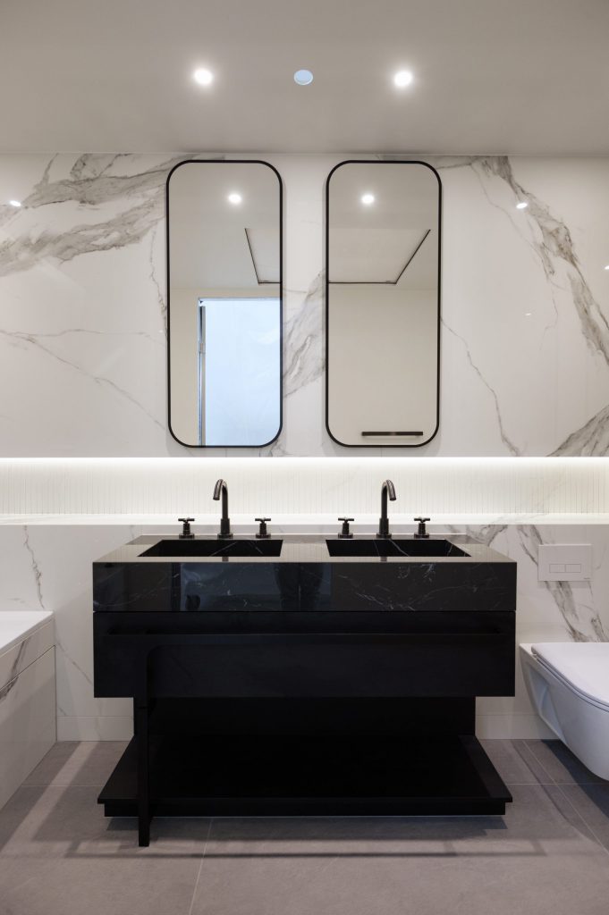 Black basin with marble surfaces in hotel