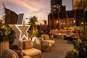 roof terrace with comfortable seating and big star statement light for The One Off
