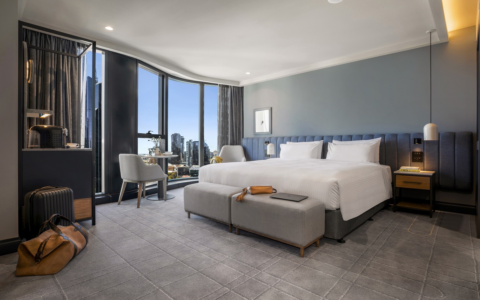 guestroom in voco Melbourne with grey wall and grey Modieus carpet and white linen