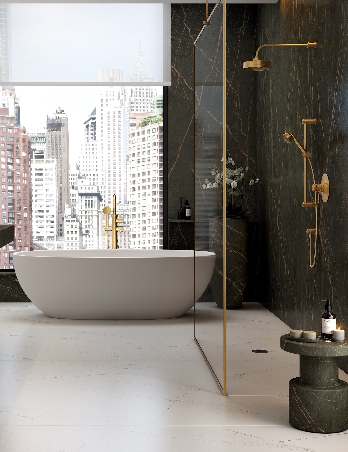 white freestanding bath in front of window overlooking city skyline. Brass finish Perrin & Rowe shower in foreground