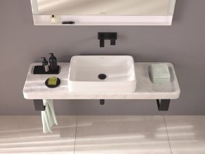 view of handbasin unit and shelf from above with curved edges, black taps and matching plug detail