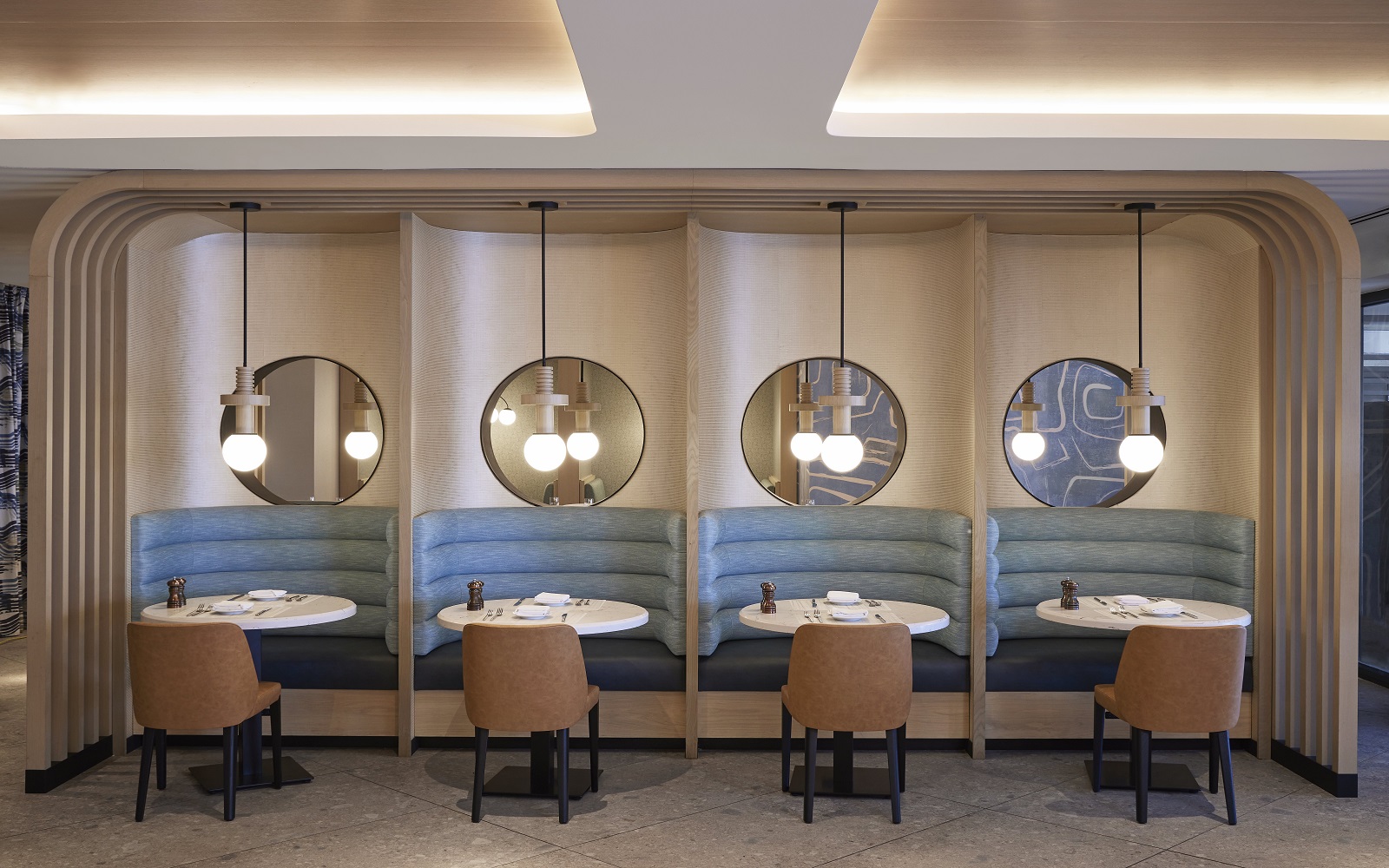 banquette and cubicle with seating and bespoke lighting in the Miami Marriott Biscayne Bay by HBA