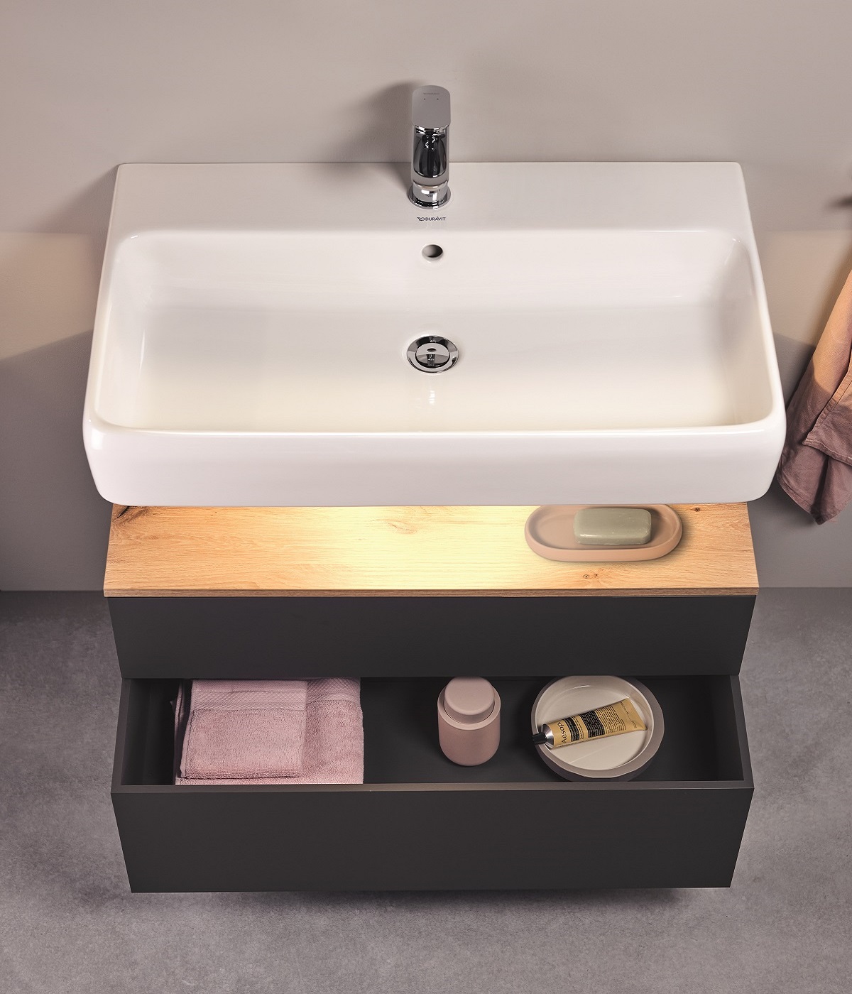 view of duravit qatego from above with lighting and shelves under the basin