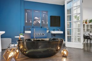 blue wall and black freestanding bagnodesign bath in london showroom