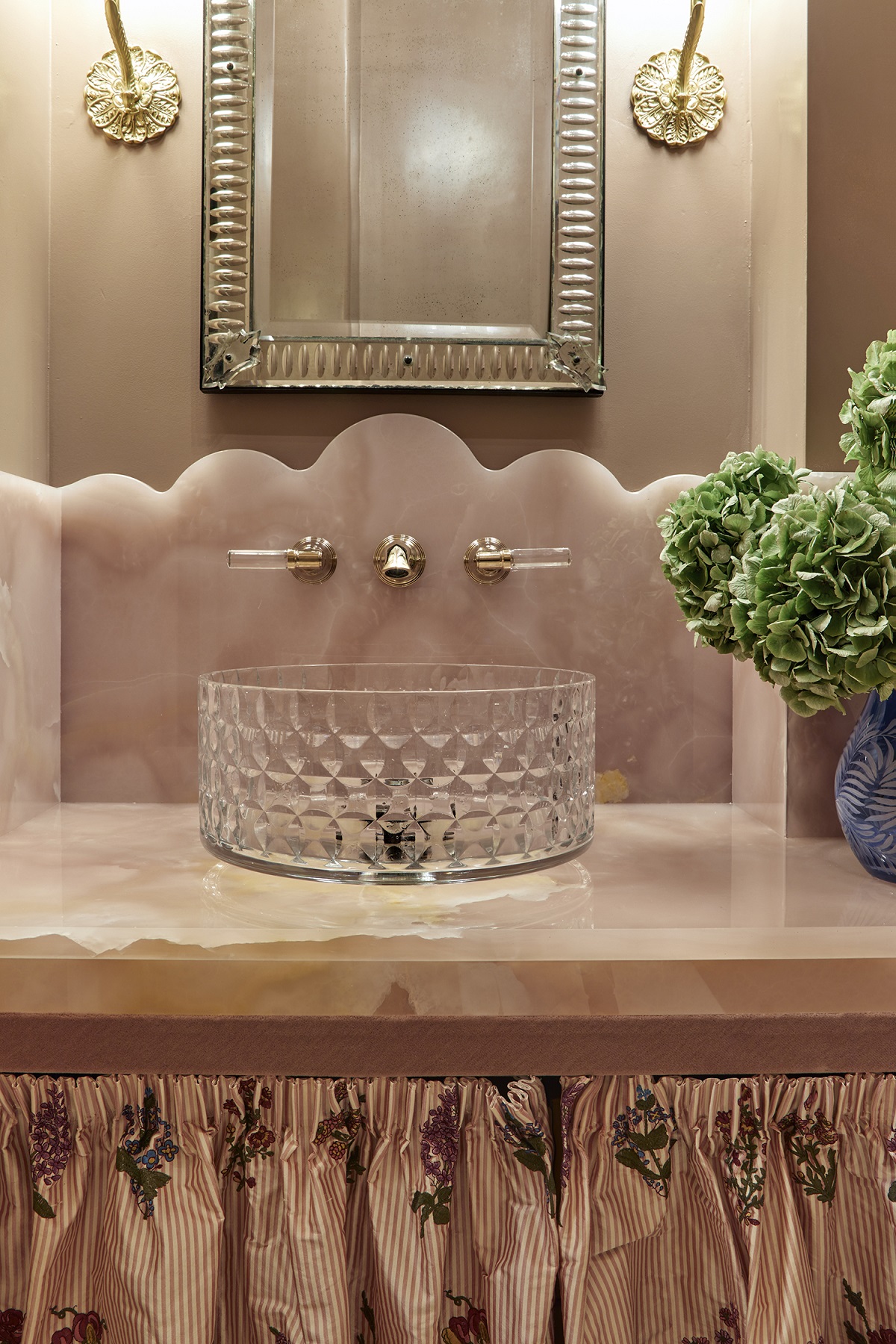 dusty pink bathroom designed by Studio Clementine with crystal handbasin and marble vanity top