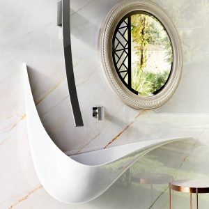 dramatic curved half moon shaped basin with vertical curved tap in Luna collection by GRAFF