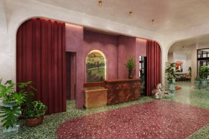 bold green and red terrazzo shapes and strong colours in the lobby of hotel Genevieve by bunkhouse 