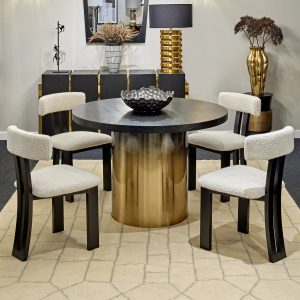 soft upholstered Tauron dining room chair by Liang & Eimil set around a round table on a structured cream carpet
