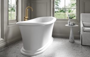 slipper shaped white freestanding Lusso bath in a beige and grey bathroom with sash windows looking over the garden
