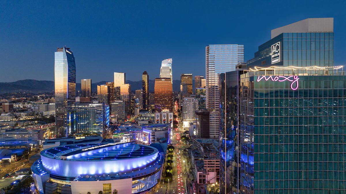 Exterior image of Moxy and AC in Downtown LA , overlooking LA skyline