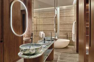bathroom in The St. Regis Kanai Resort with wood, marble and mirrored surfaces