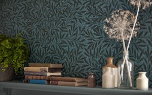 bookshelf with Morris & Co willow wallpaper in green behind books and vases