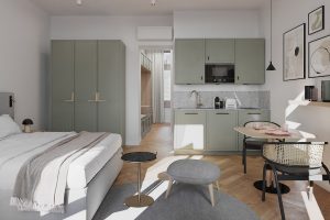 sage green and white living space in an aparthotel with bed, kitchen, workspace and storage