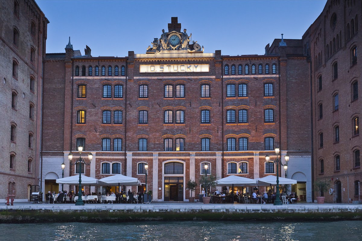 Exterior of Hilton Venice with sign of G. STUCKY on wall