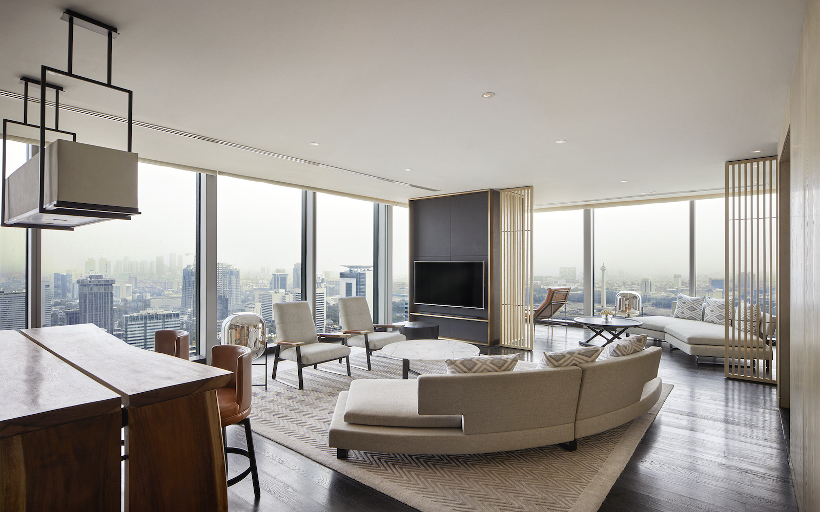 Large suite with white interior design scheme inside Park Hyatt Jakarta