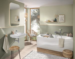 sage green bathroom walls with white bath and wooden surfaces from Villeroy & Boch