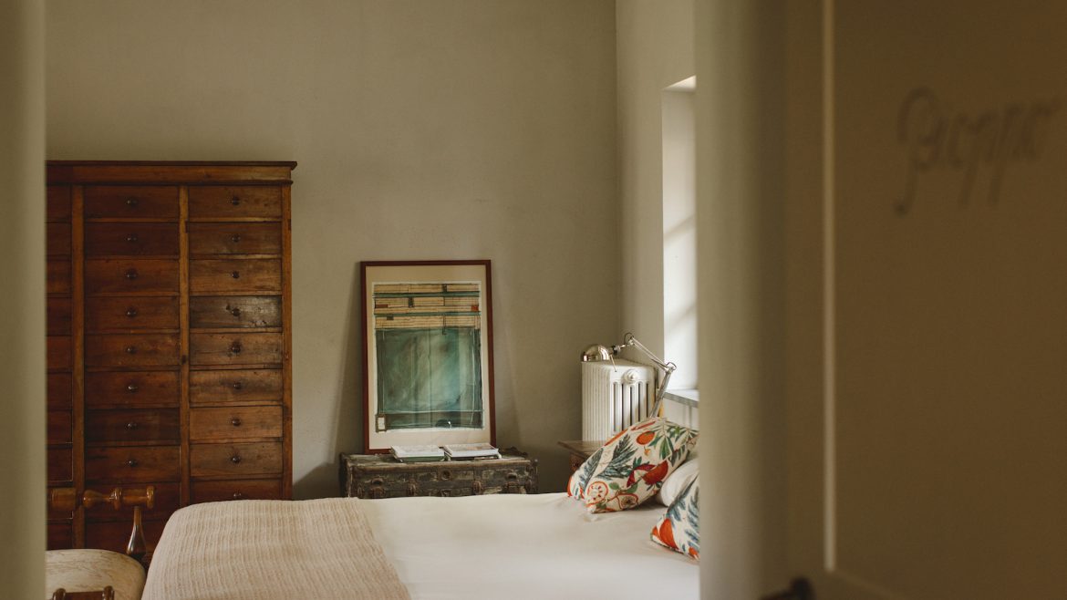 Green walls and chilled design scheme inside bedroom