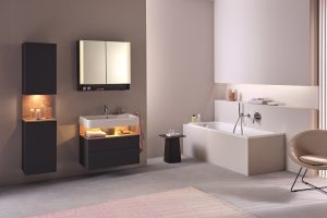beige bathroom walls with wooden and white fittings and furniture by duravit with focussed lighting in the shelves and under the basin