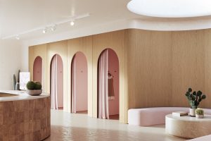 boutique change rooms in white and cream and pink shop interior with arches and curved light wood veneer surfaces