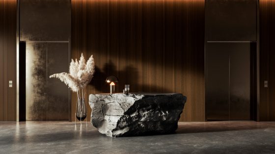 lobby with dark wood veneer walls behind rock form of desk and plants