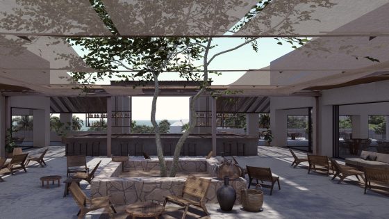 central courtyard with a tree and canopy surrounded by seating and hotel lobby