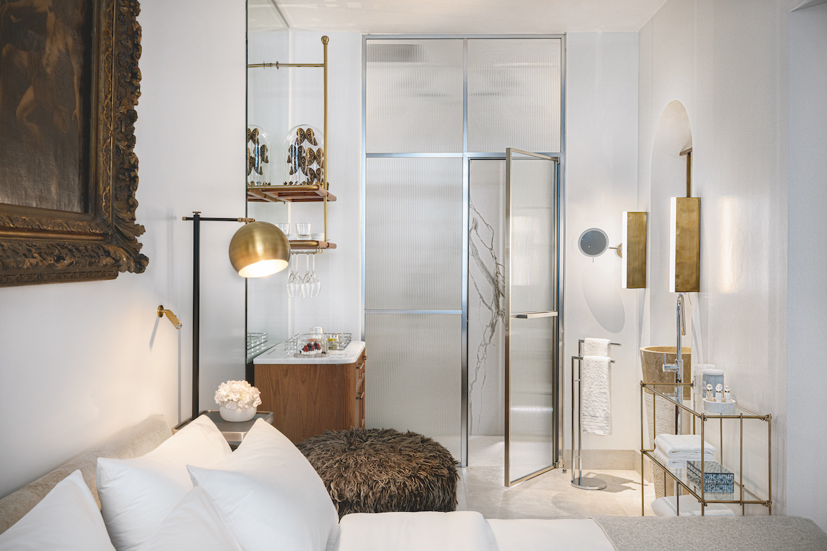 A luxury room in a hotel in Athens with frosted glass blocking the shower